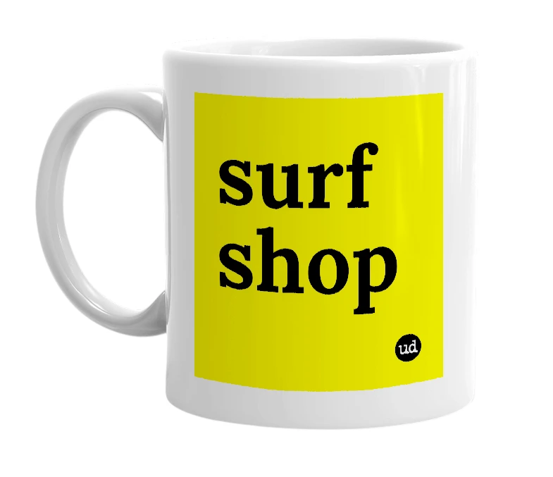 White mug with 'surf shop' in bold black letters