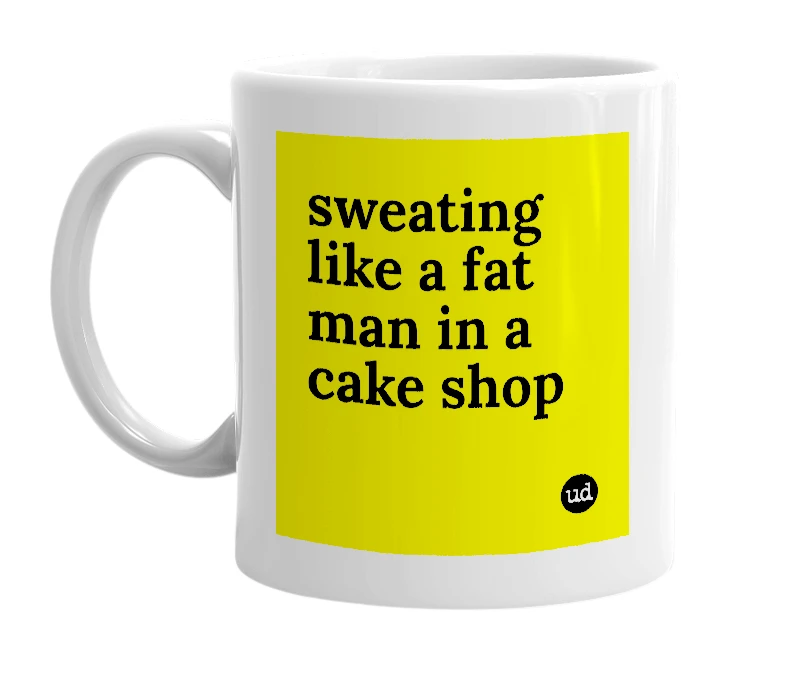 White mug with 'sweating like a fat man in a cake shop' in bold black letters