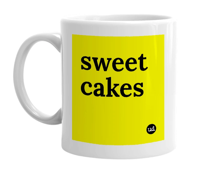 White mug with 'sweet cakes' in bold black letters