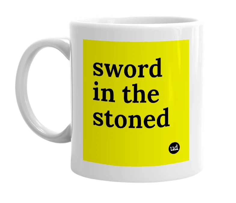 White mug with 'sword in the stoned' in bold black letters