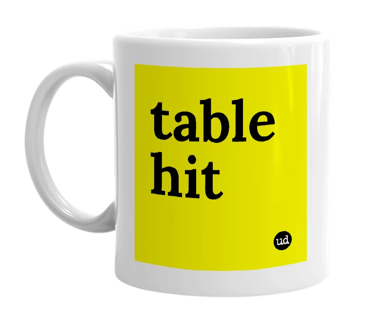 White mug with 'table hit' in bold black letters