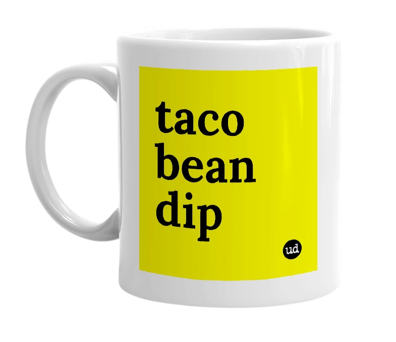 White mug with 'taco bean dip' in bold black letters