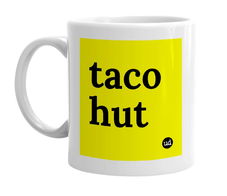 White mug with 'taco hut' in bold black letters