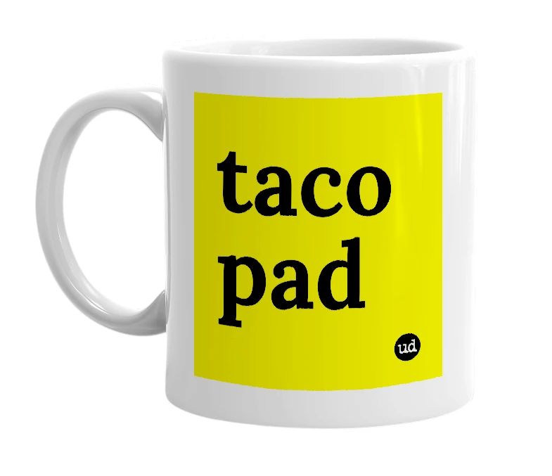 White mug with 'taco pad' in bold black letters