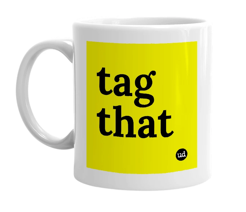 White mug with 'tag that' in bold black letters