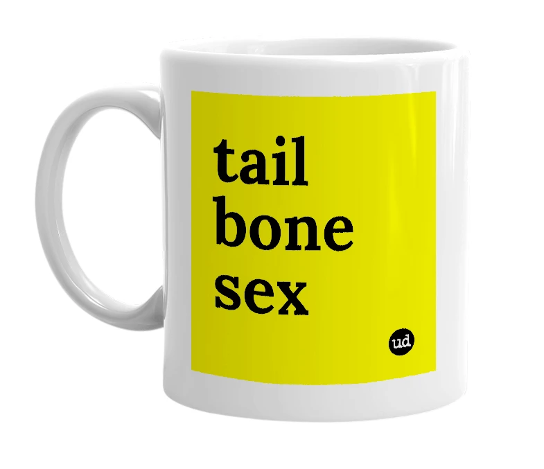 White mug with 'tail bone sex' in bold black letters