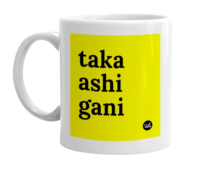 White mug with 'taka ashi gani' in bold black letters