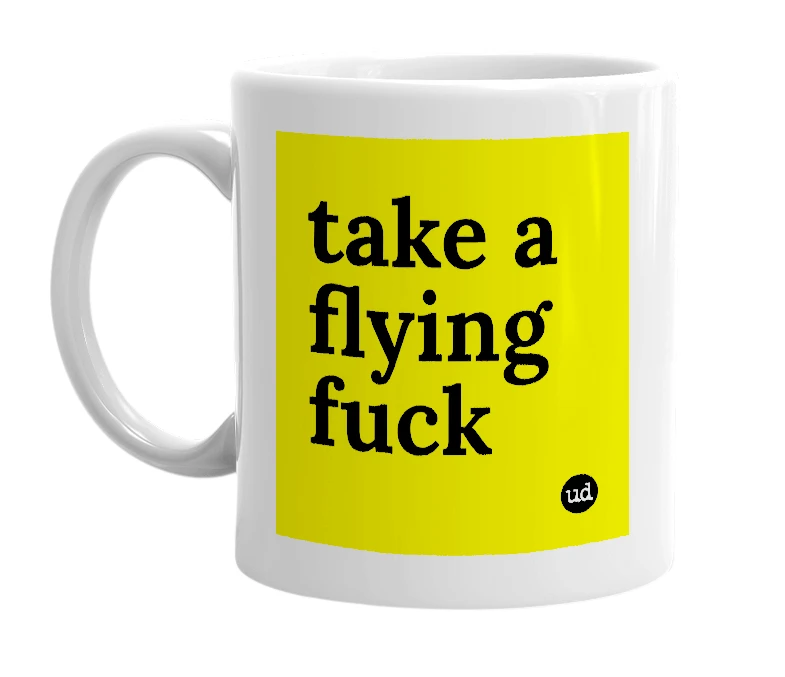 White mug with 'take a flying fuck' in bold black letters