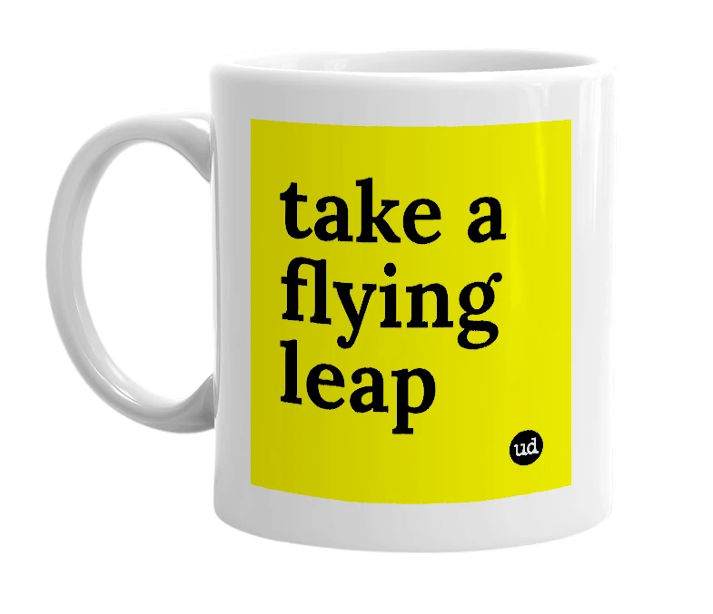 White mug with 'take a flying leap' in bold black letters