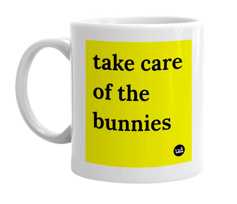 White mug with 'take care of the bunnies' in bold black letters