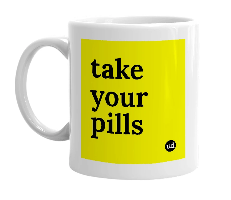 White mug with 'take your pills' in bold black letters
