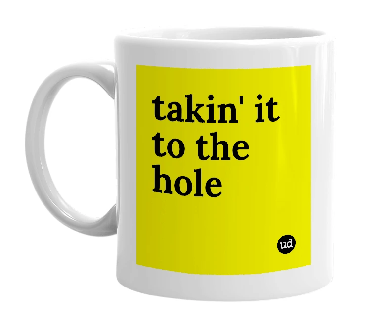 White mug with 'takin' it to the hole' in bold black letters