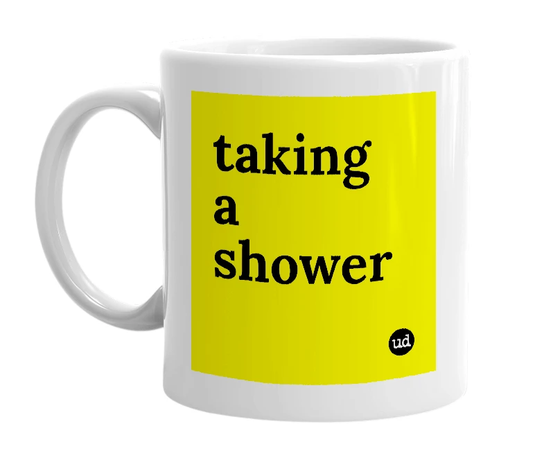 White mug with 'taking a shower' in bold black letters