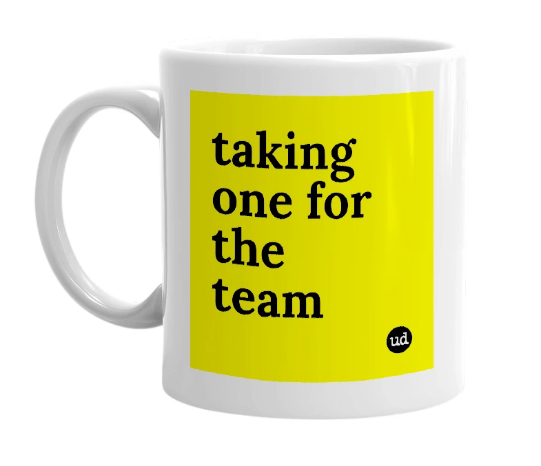 White mug with 'taking one for the team' in bold black letters