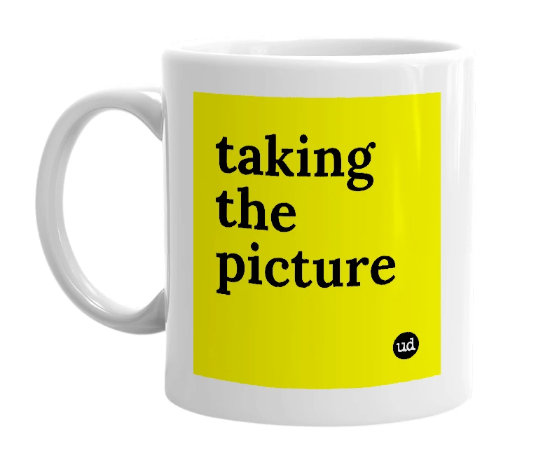 White mug with 'taking the picture' in bold black letters