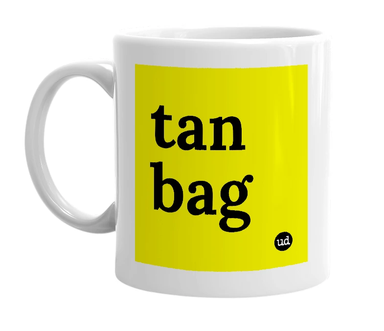 White mug with 'tan bag' in bold black letters