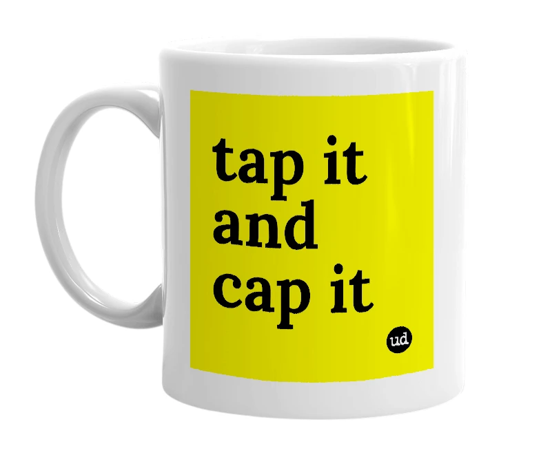 White mug with 'tap it and cap it' in bold black letters