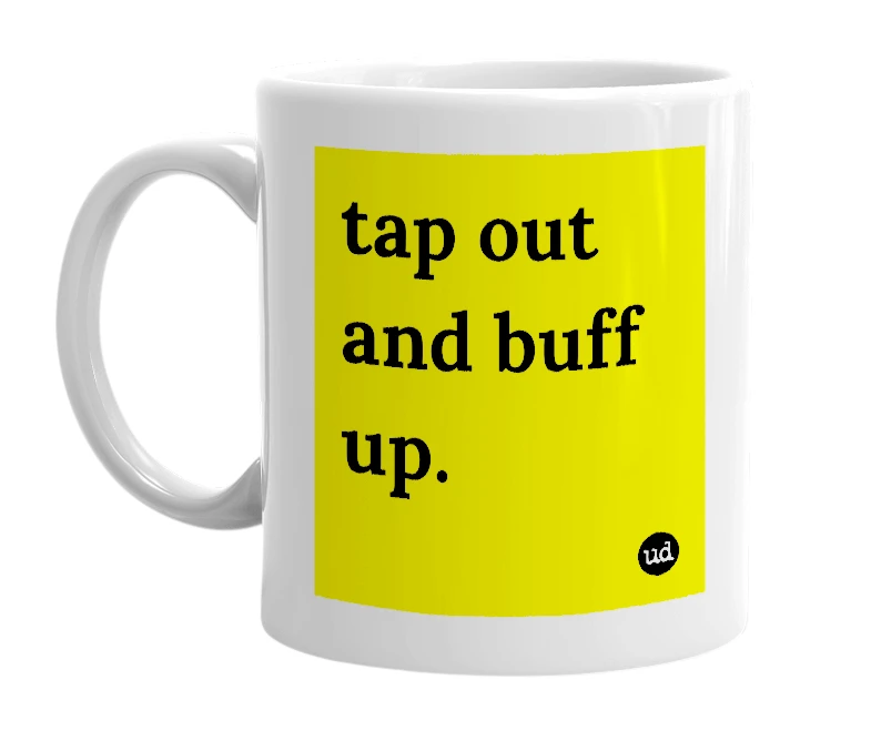 White mug with 'tap out and buff up.' in bold black letters