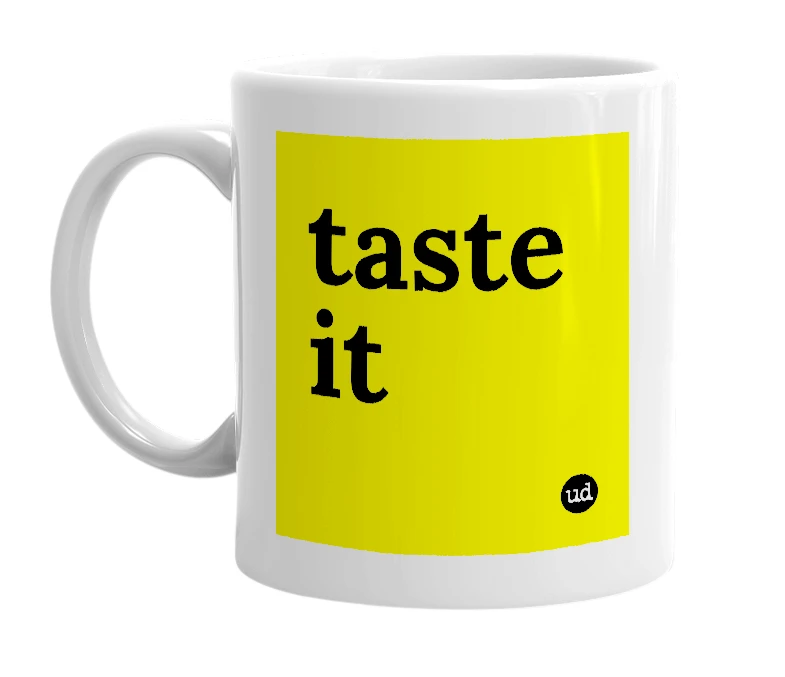 White mug with 'taste it' in bold black letters