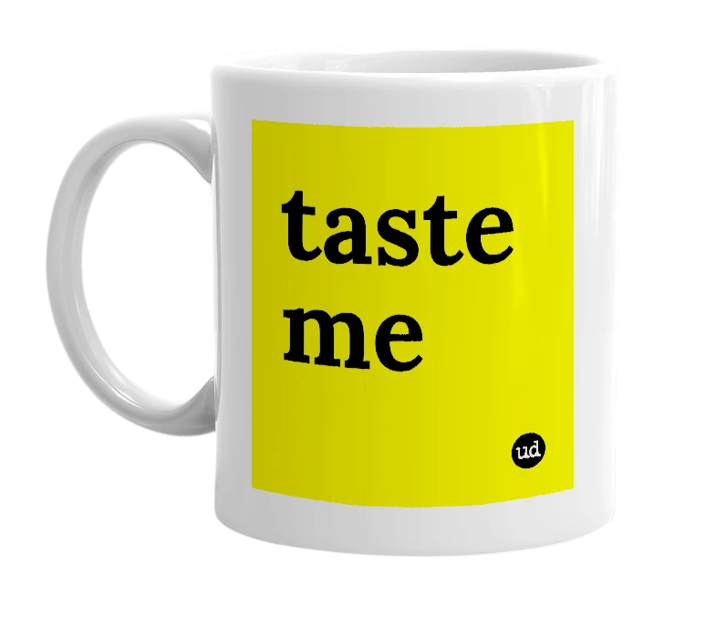 White mug with 'taste me' in bold black letters