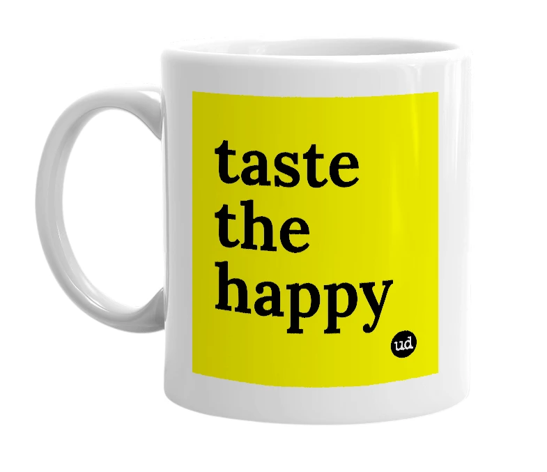 White mug with 'taste the happy' in bold black letters