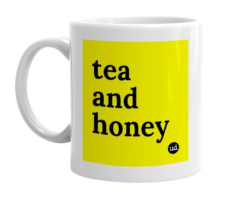 White mug with 'tea and honey' in bold black letters