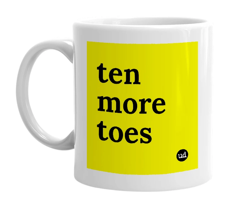 White mug with 'ten more toes' in bold black letters