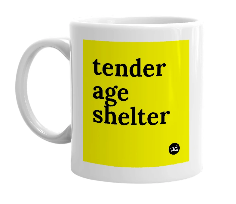 White mug with 'tender age shelter' in bold black letters