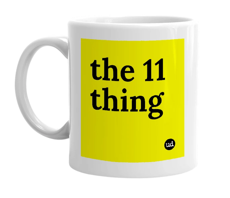 White mug with 'the 11 thing' in bold black letters