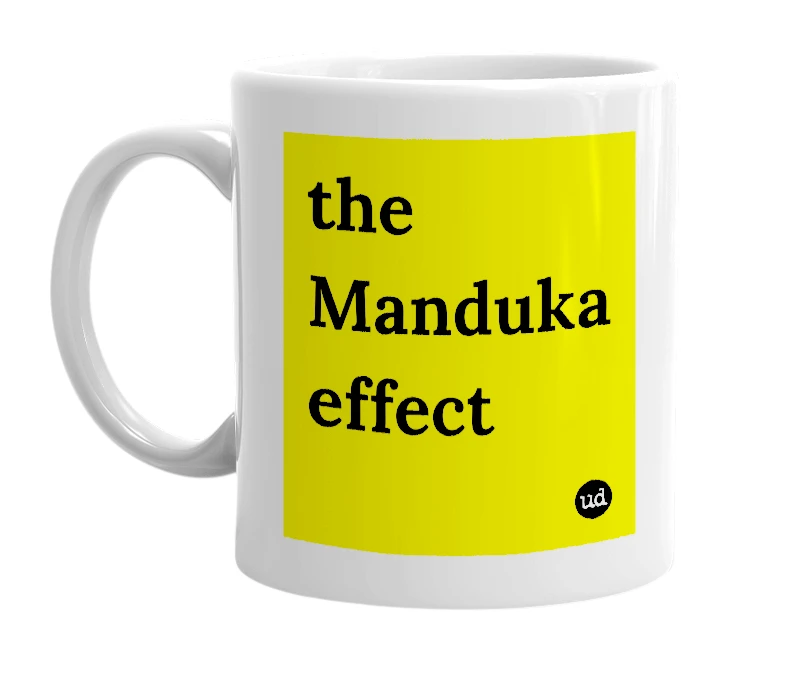 White mug with 'the Manduka effect' in bold black letters