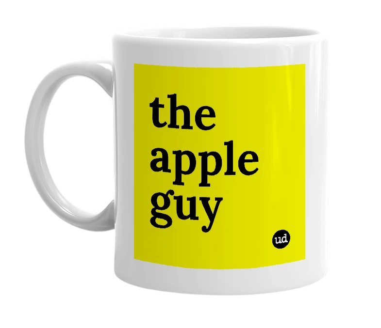 White mug with 'the apple guy' in bold black letters