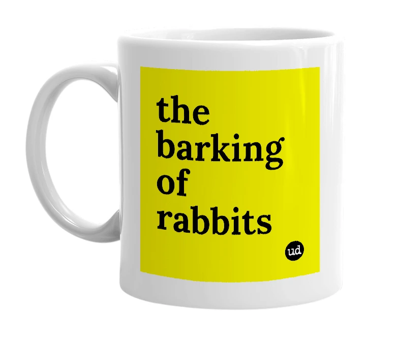 White mug with 'the barking of rabbits' in bold black letters