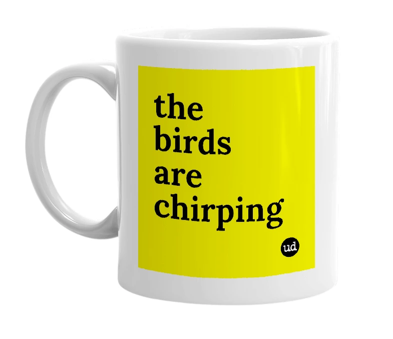 White mug with 'the birds are chirping' in bold black letters