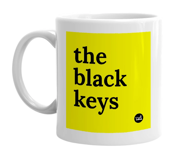 White mug with 'the black keys' in bold black letters