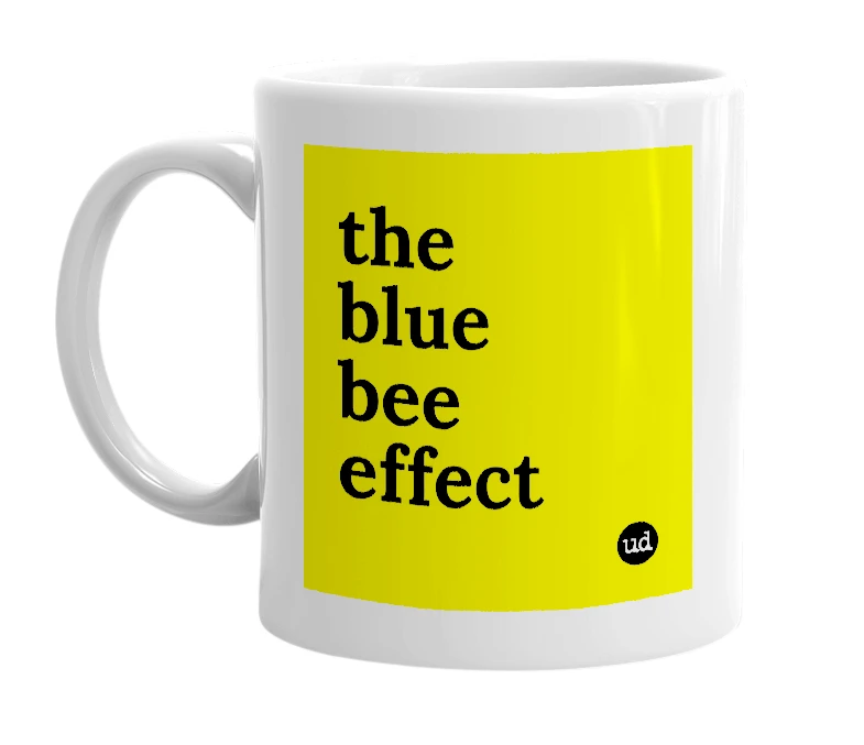 White mug with 'the blue bee effect' in bold black letters