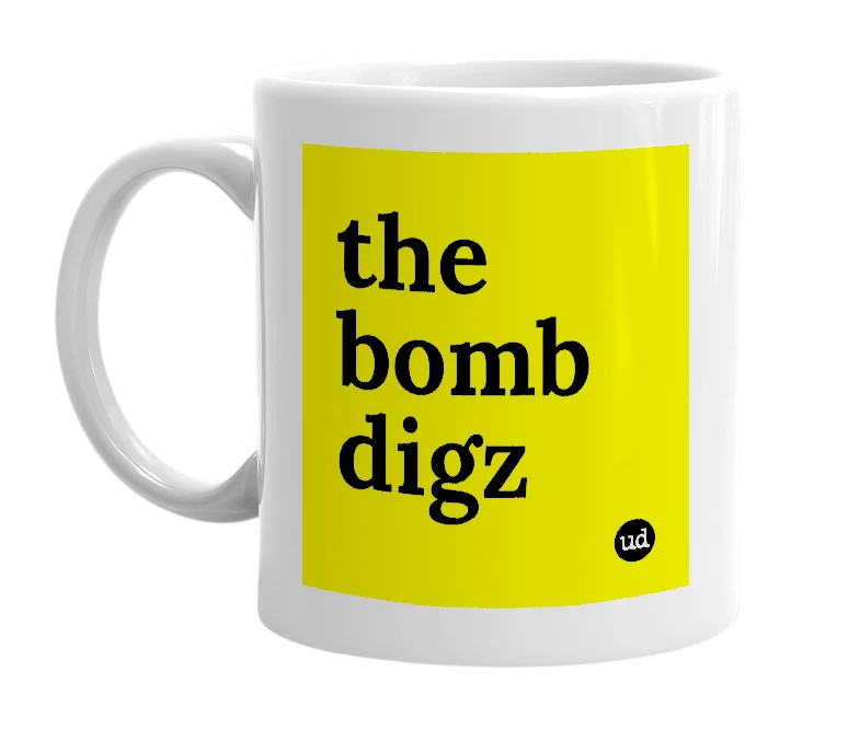 White mug with 'the bomb digz' in bold black letters