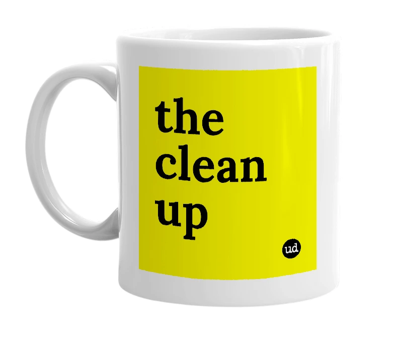 White mug with 'the clean up' in bold black letters