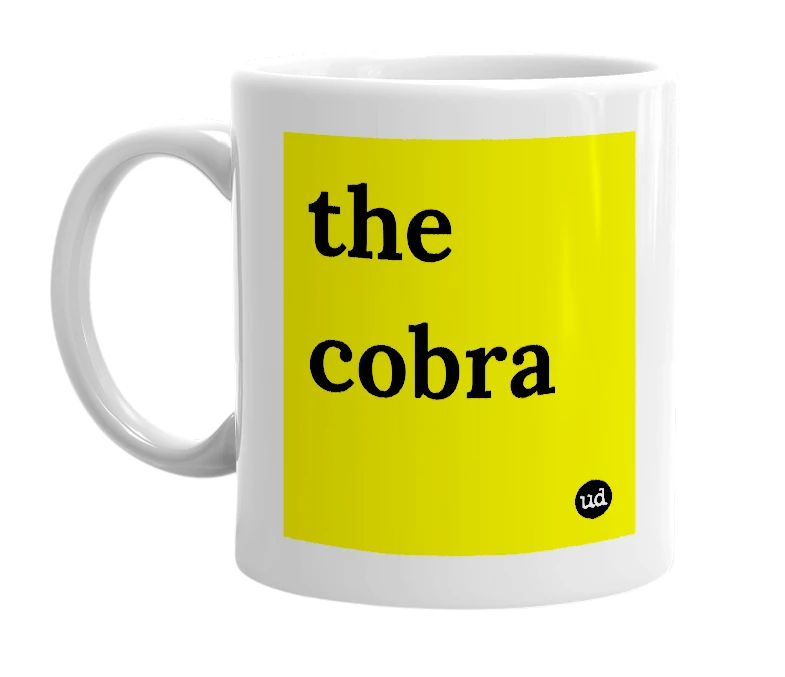 White mug with 'the cobra' in bold black letters