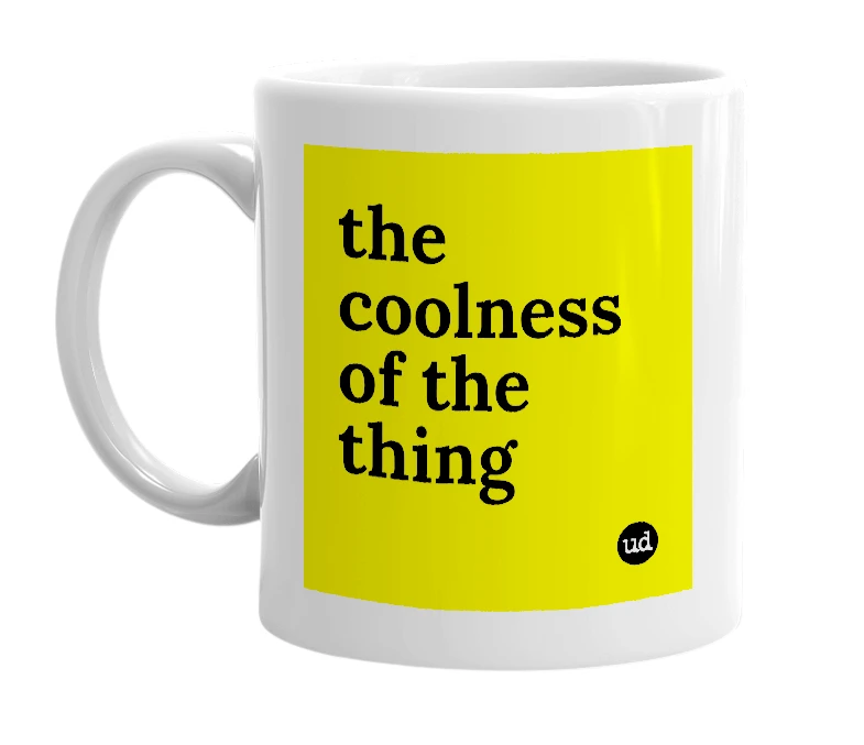White mug with 'the coolness of the thing' in bold black letters