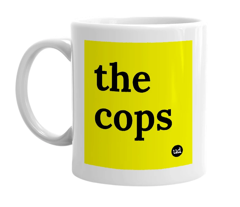 White mug with 'the cops' in bold black letters