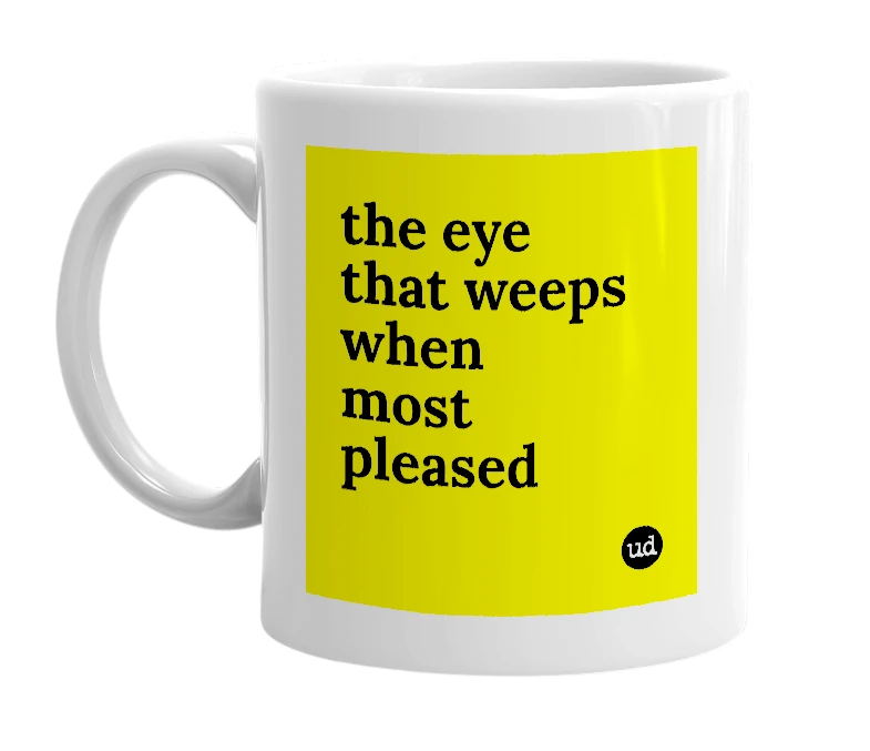 White mug with 'the eye that weeps when most pleased' in bold black letters