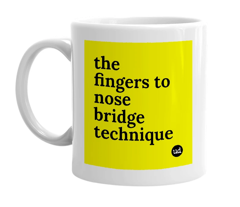 White mug with 'the fingers to nose bridge technique' in bold black letters