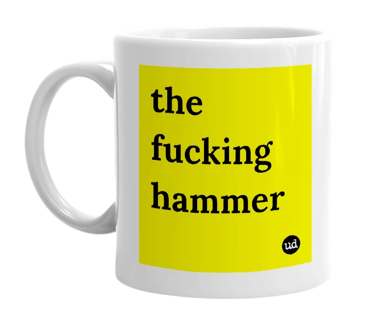 White mug with 'the fucking hammer' in bold black letters