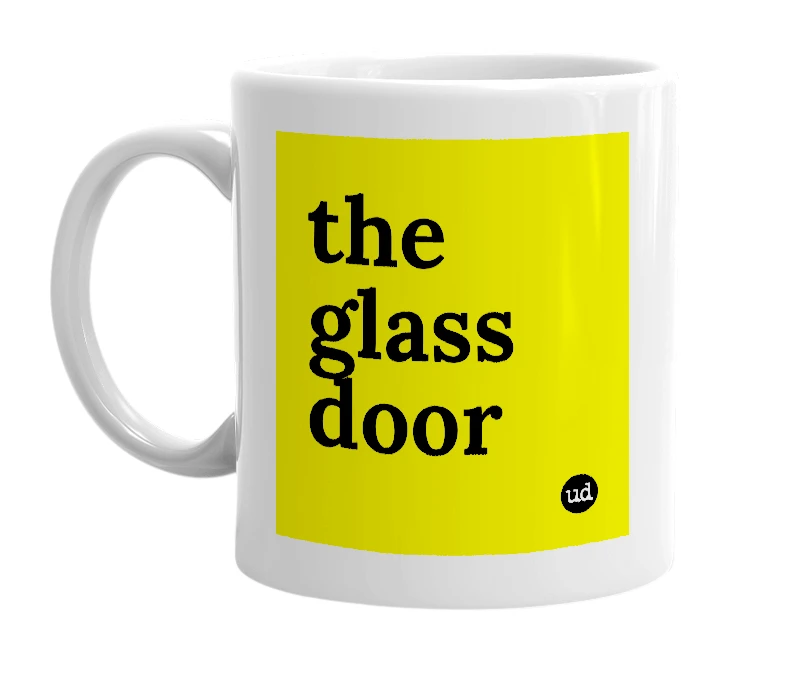 White mug with 'the glass door' in bold black letters