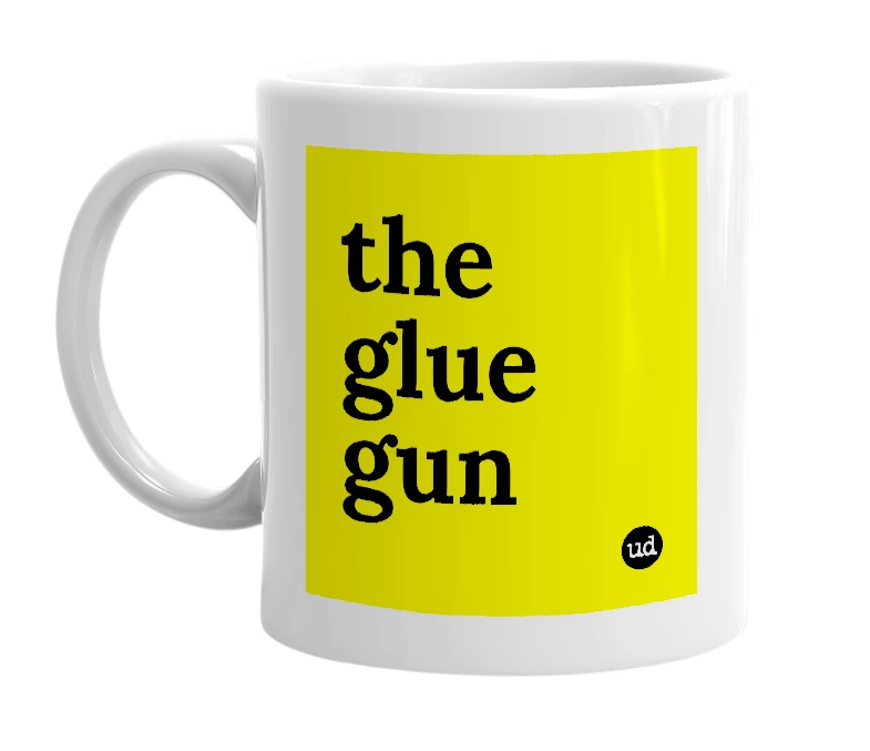 White mug with 'the glue gun' in bold black letters