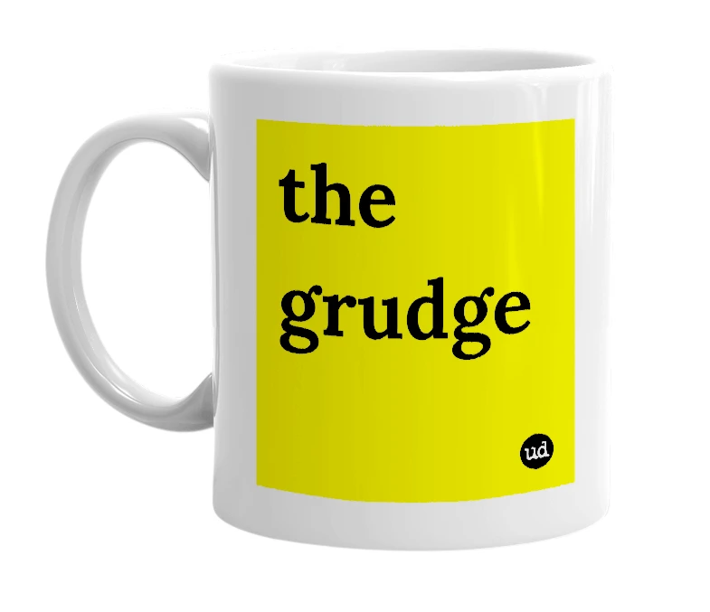 White mug with 'the grudge' in bold black letters