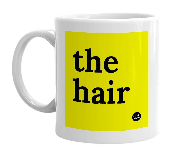 White mug with 'the hair' in bold black letters