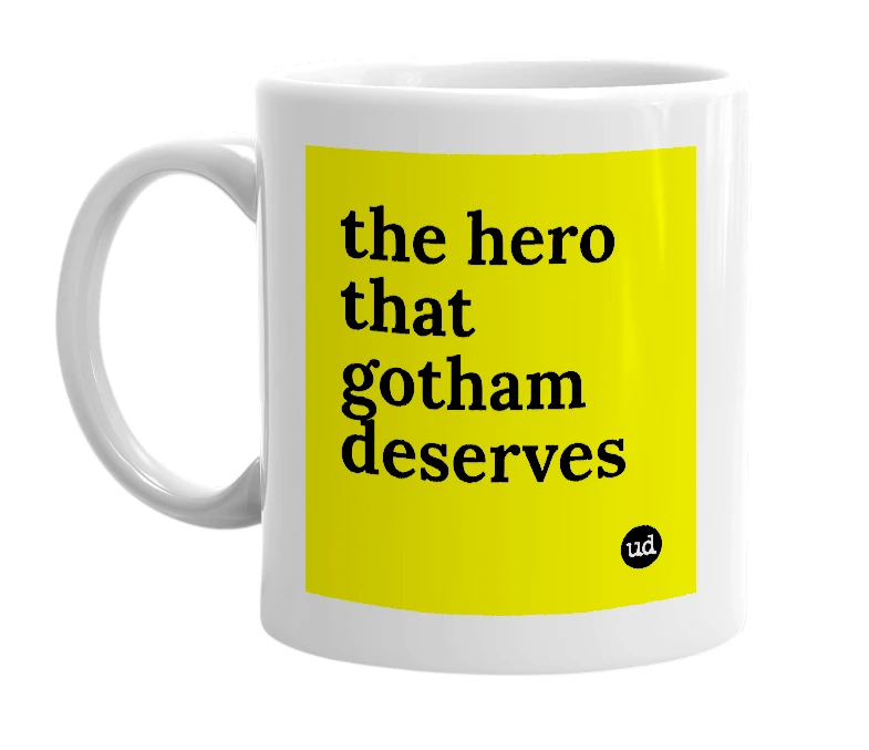 White mug with 'the hero that gotham deserves' in bold black letters