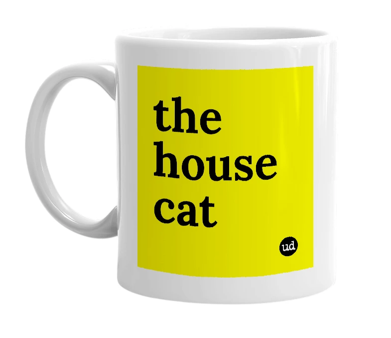 White mug with 'the house cat' in bold black letters