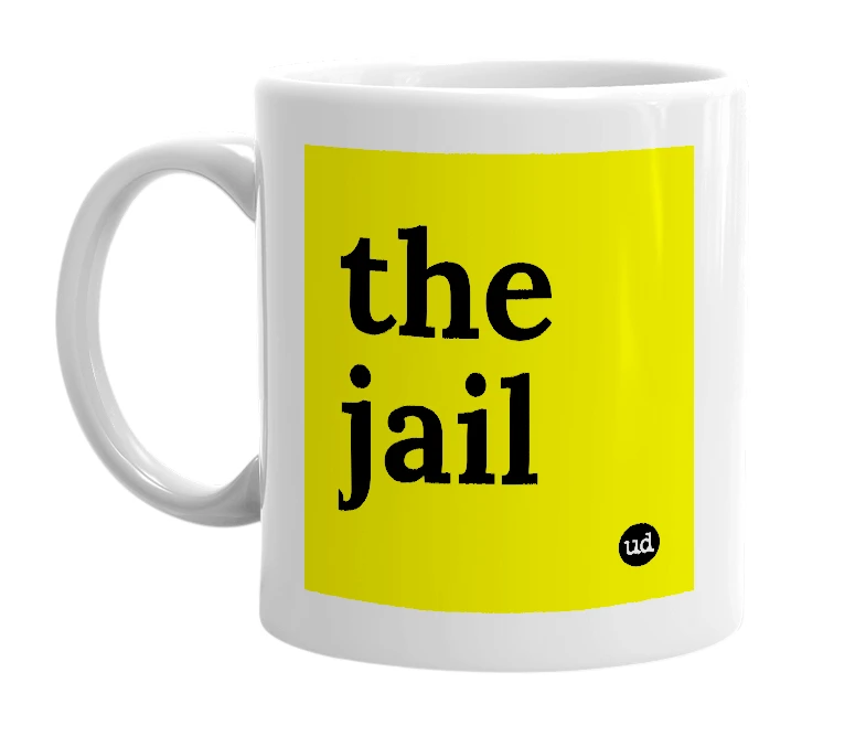 White mug with 'the jail' in bold black letters